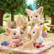 Fennec Fox Twins playing in sand with detailed clothing and miniature beach toys in a charming outdoor setting.