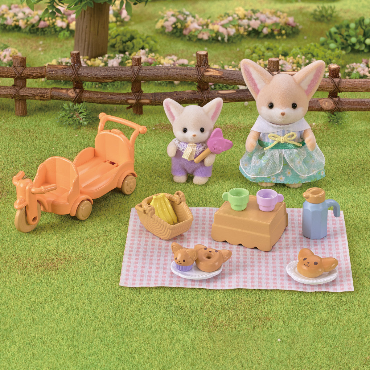 Fennec Fox Sunny Picnic Set with poseable dolls, orange tricycle wagon, checkered blanket, basket, and picnic accessories.