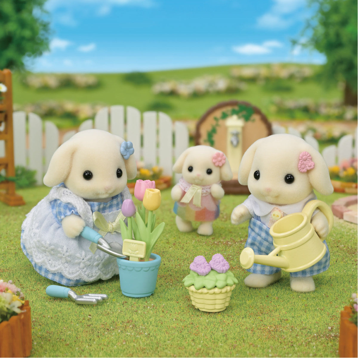 Blossom Gardening Set with Flora Rabbit siblings gardening tulips and flowers in a vibrant outdoor scene.