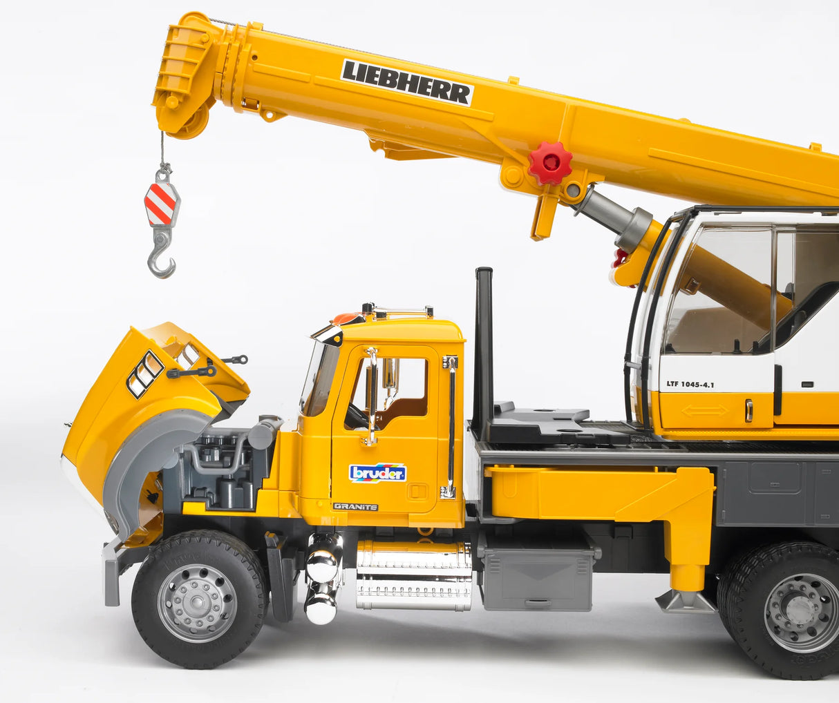 MACK Granite Liebherr Crane Truck with extended yellow boom, open hood showing engine details, and realistic cab features.