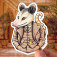 Dapper Possum Sticker featuring a posh opossum in a vintage suit, waterproof and UV protected art by Ryan McCulloch.