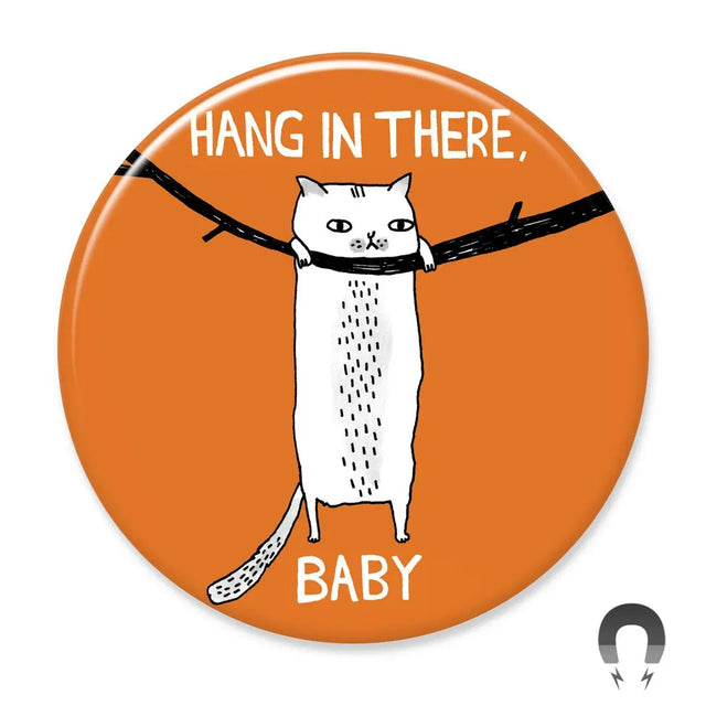 Hang in There Baby Cat Magnet with white cat hanging on branch on orange background, 2.25 inches, recycled materials.