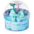 Mermaid Frosting Butter Slime in blue container with mermaid tails, bow, and colorful toppings for playful sensory fun.
