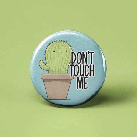 Button | Don't Touch Me Cactus featuring a cute cactus in a pot with "Don't Touch Me" text, 1.25 inches in size.