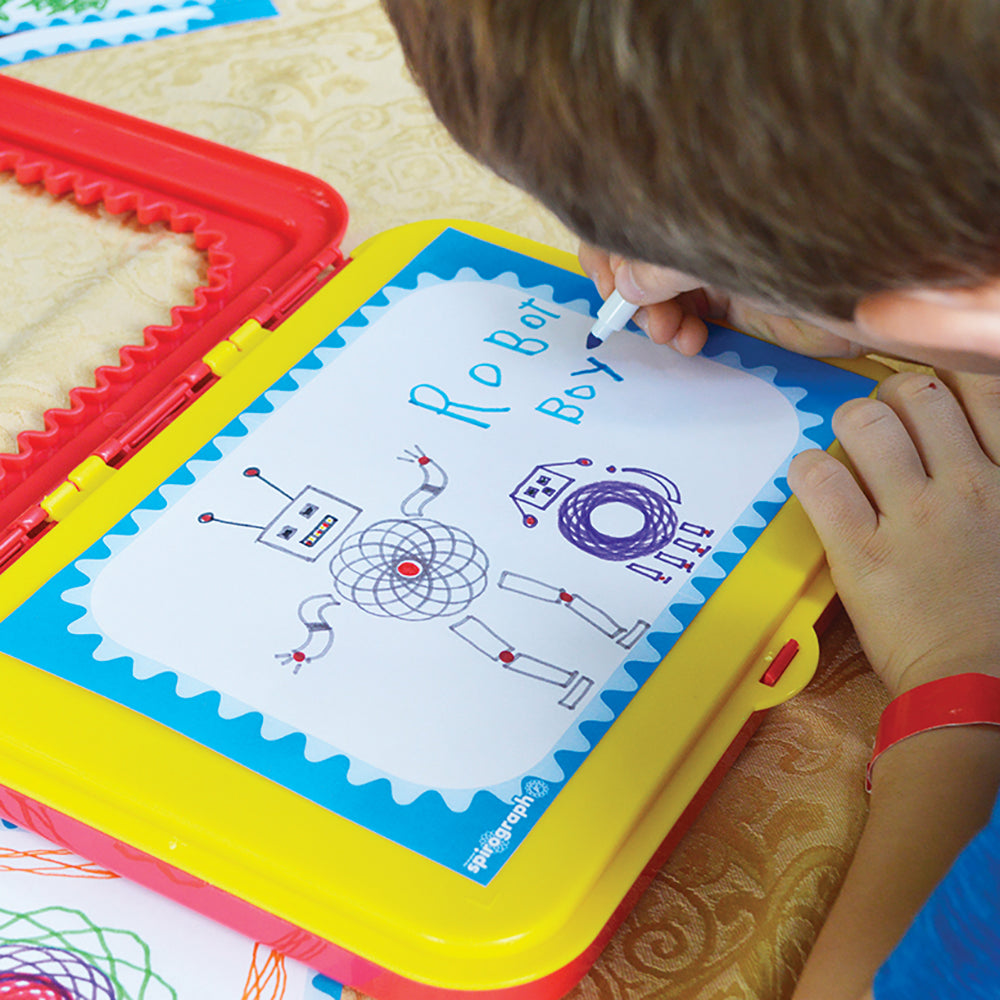 Child drawing robot design on Spirograph Original Jr drawing tablet with colorful gears nearby