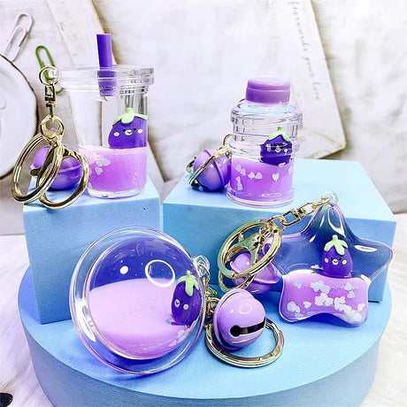 Eggplant Floaty Charm Keychain with cute purple eggplant designs in various clear floaty shapes for bags and keys.