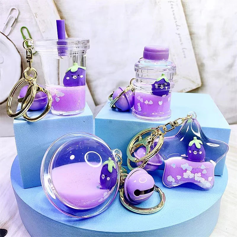 Eggplant Floaty Charm Keychain with cute purple eggplant designs in various clear floaty shapes for bags and keys.