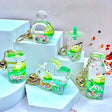 Frog Boba Floaty Keychain featuring assorted clear liquid designs with floating frog and colorful confetti inside.
