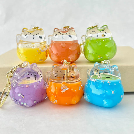 Colorful Cat Floaty KeyChain in assorted bright colors with cute cat design and attached keyring for easy clipping.