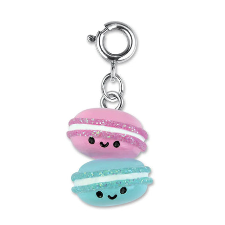 Macaron Buddies Charm features two smiling 3D pink and blue macarons with glitter and enamel details on a silver clasp.
