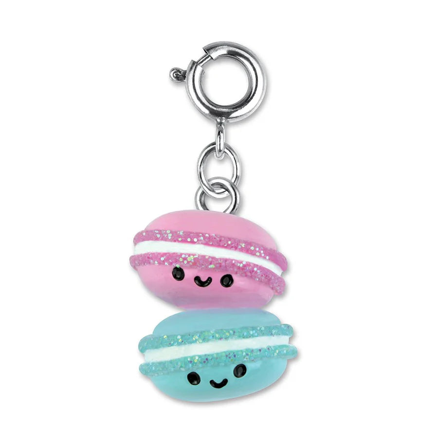 Macaron Buddies Charm features two smiling 3D pink and blue macarons with glitter and enamel details on a silver clasp.