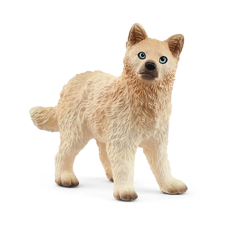 Arctic Wolf Cub figurine with cream-colored fur and bright blue eyes, standing in a playful pose.