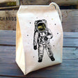 Lunch Bag | Astronaut featuring a black and gold printed astronaut design on recycled cotton fabric with a drawstring closure.