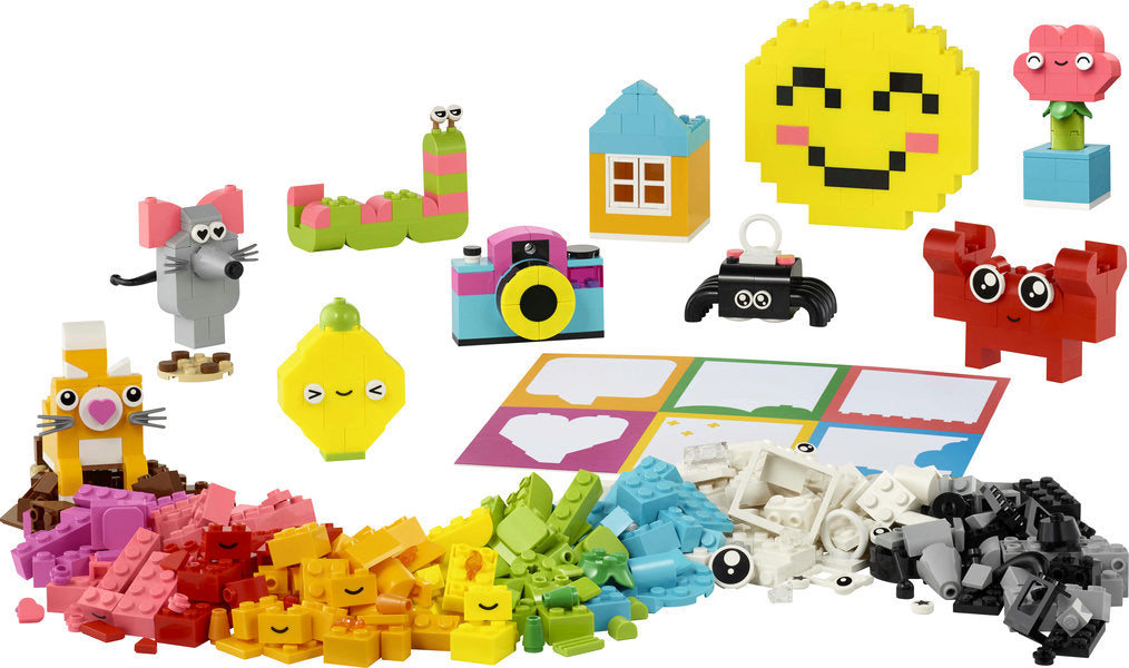 LEGO Classic Creative Happy Box with colorful bricks and models including smiley face, crab, flower, and camera designs.