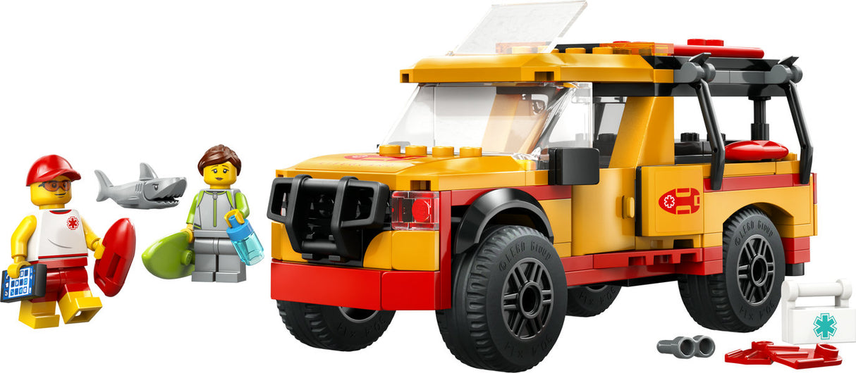 LEGO City Lifeguard Beach Rescue Truck with lifeguard, surfer minifigures, shark figure, surfboards, and rescue gear.