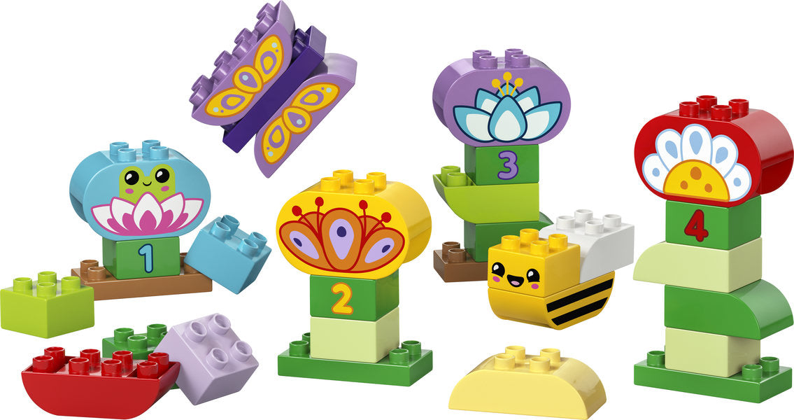 Duplo Creative Garden & Flowers with colorful numbered bricks, butterfly, bee, frog figures for preschool learning fun.