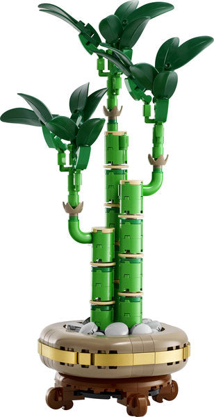 Botanicals Lucky Bamboo LEGO set featuring three green bamboo stems with leaves and decorative pebbles on a wood-effect plinth.