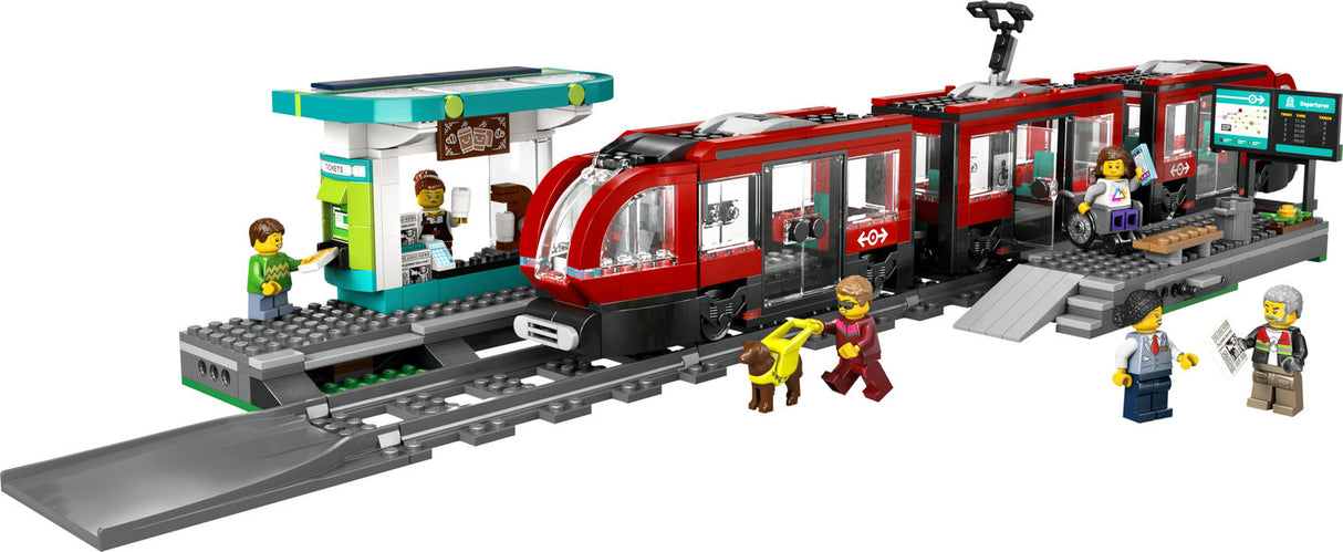 LEGO City Downtown Streetcar and Station set showing red streetcar, station with coffee shop, platform, and six minifigures.