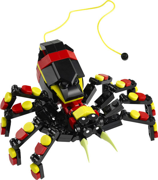Creator Wild Animals Surprising Spider LEGO toy with extendable string and posable legs in black, red, and yellow design.