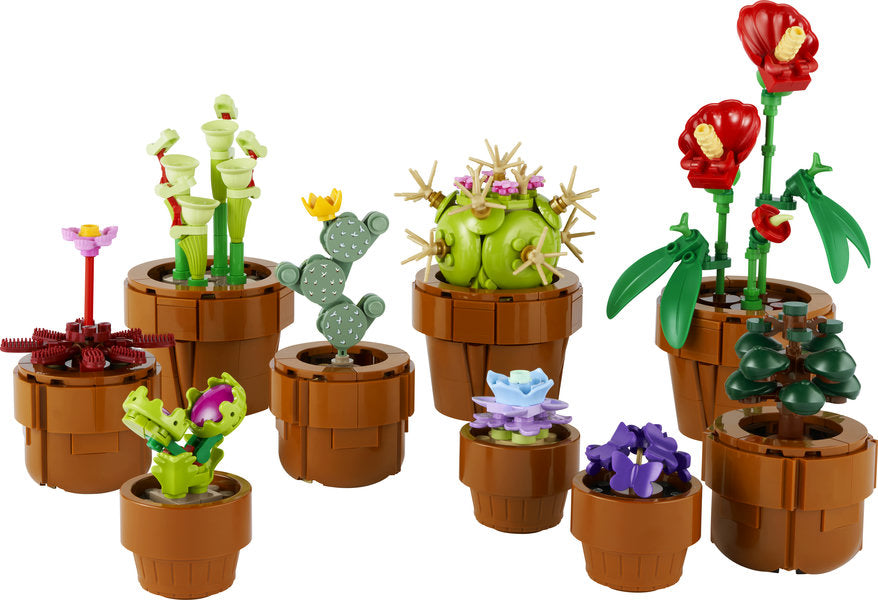 Botanicals Tiny Plants LEGO set showing nine detailed buildable plant models in terracotta-colored pots.