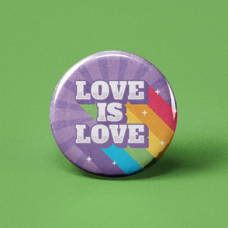 Button | Love is Love pinback button with rainbow design and bold text to express pride and support for love equality.