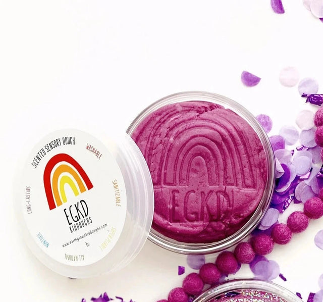 KidDough Glitter | Purple shown open with smooth, pliable purple dough and glittery decorations nearby.