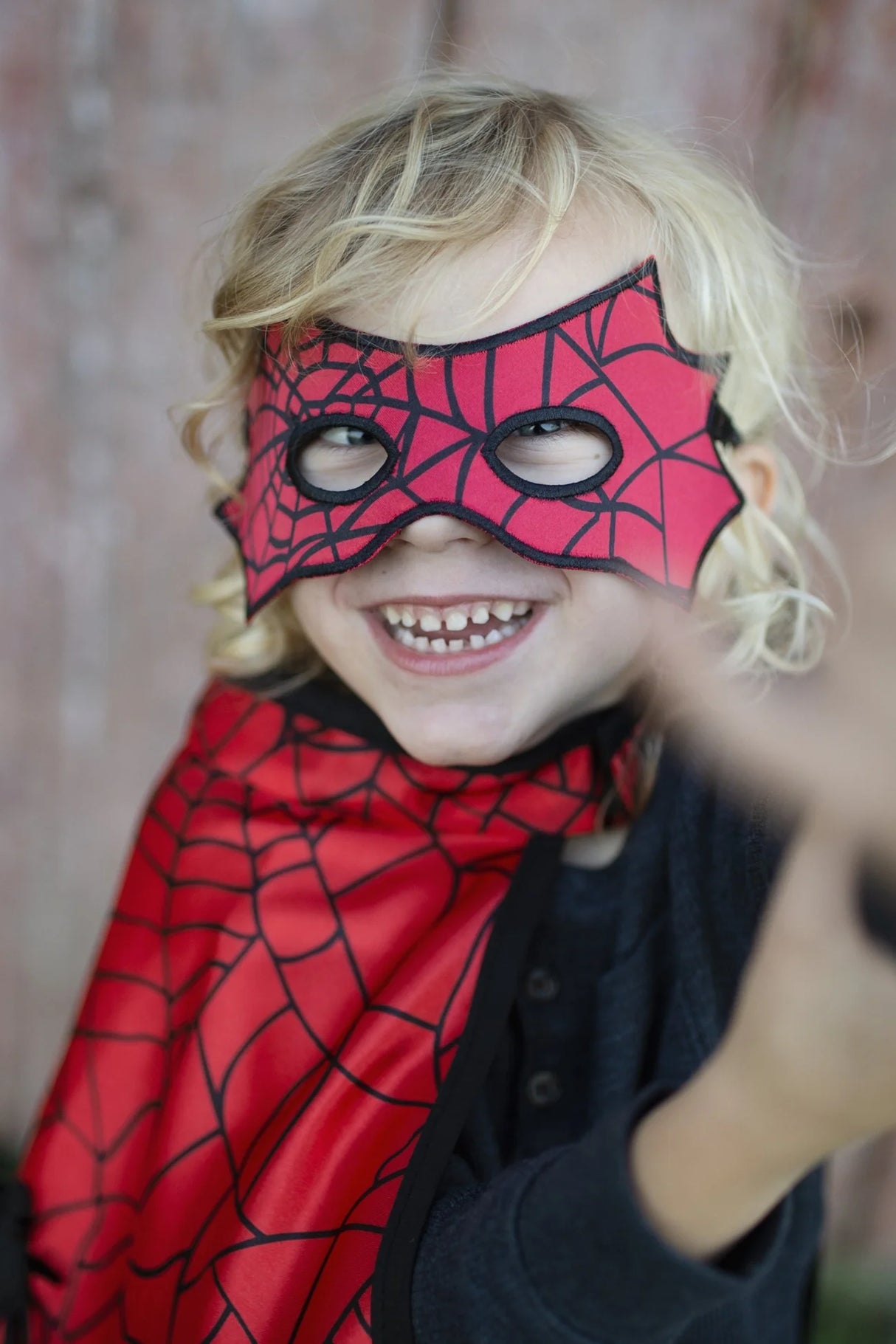 Spider Bat Reversible Cape & Mask Size 4-6 featuring red spider web mask and cape worn by smiling child.