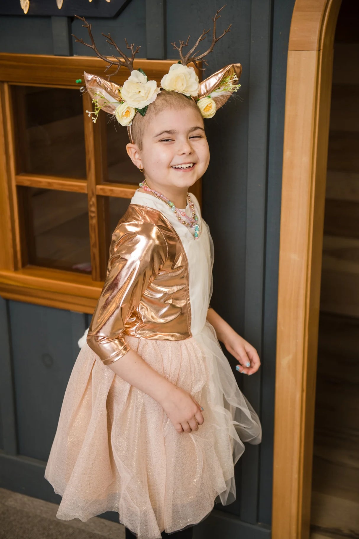 Woodland Deer Dress & Headband | Size 5-6 worn by smiling child with floral antler headband and glittery tulle skirt.