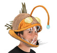 Light-Up Angler Fish Jawesome Hat worn by a person, featuring soft materials and a light-up esca on a brown angler fish design.