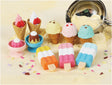 Japanese Eraser Ice Cream set with assorted colorful erasers shaped like ice cream cones and popsicles on creamy background.