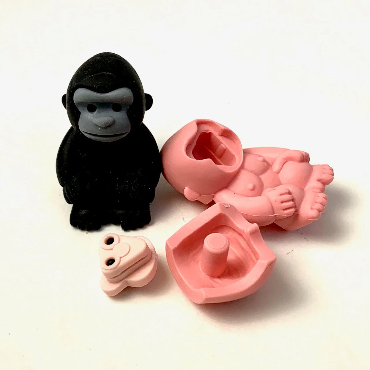 Japanese Eraser Safari showing a black gorilla eraser and its pink puzzle pieces separated for assembly.