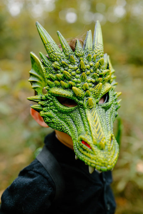 Dragon Mask | Green worn by child showing detailed rubberized foam texture and vibrant green scales outdoors.