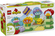 Duplo Creative Garden & Flowers with 45 colorful bricks featuring flowers, butterfly, bee, and frog for preschool learning.