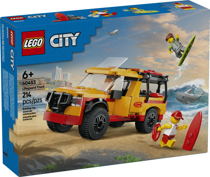 LEGO City Lifeguard Beach Rescue Truck with lifeguard, surfer minifigures, surfboards, and shark figure on beach scene