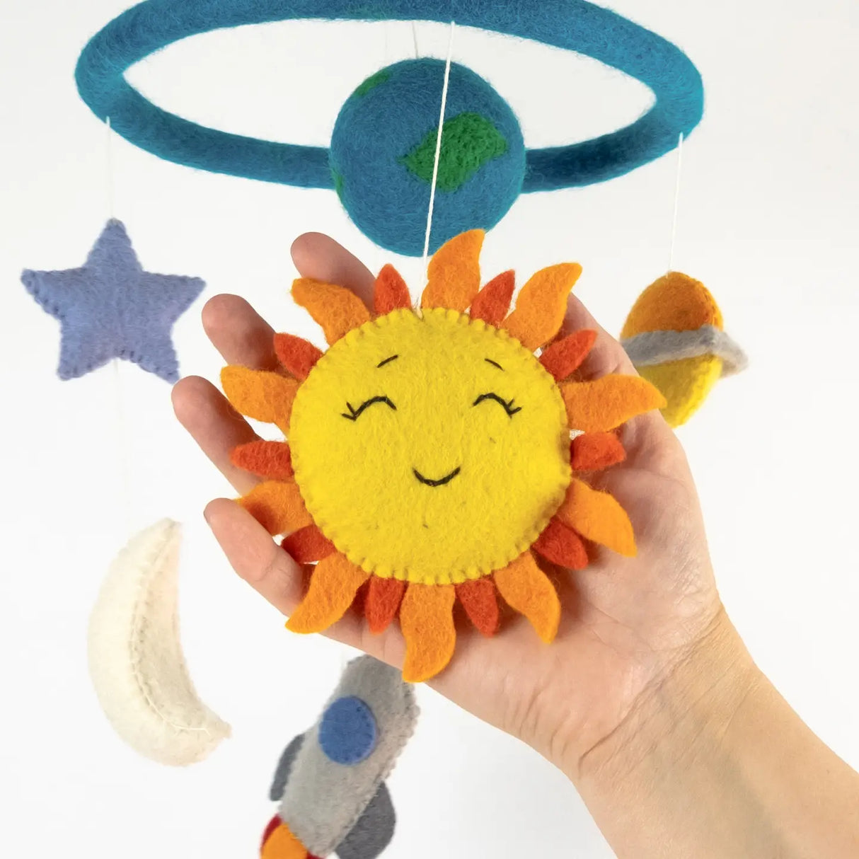 Felt Mobile | Planets & Space showing a handmade bright felt sun and planets hanging from a blue hoop for nursery decor.