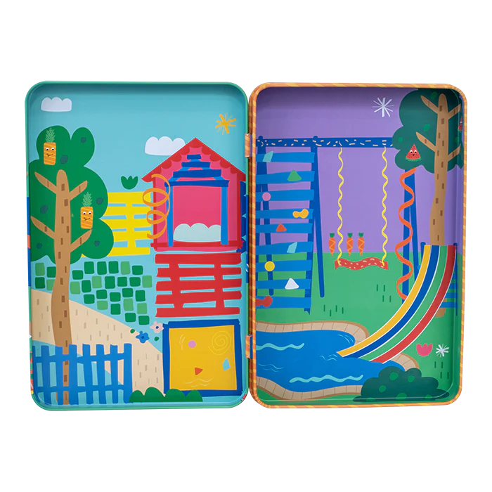 Magnetic Playtime | Pets tin open showing two colorful play scenes with trees, house, slide, and swings inside.