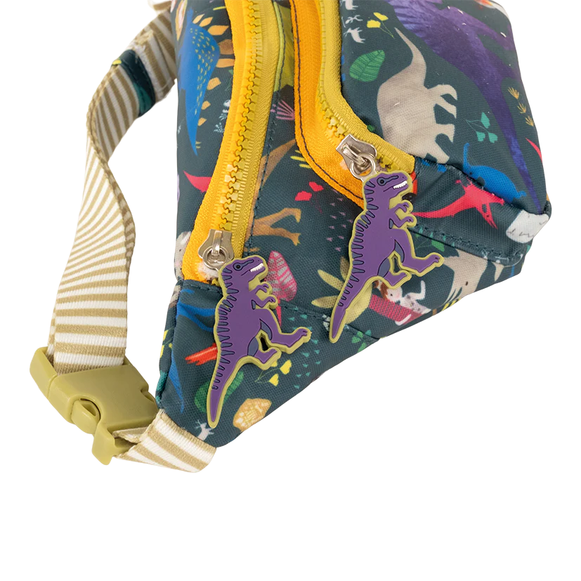 Belt Bag | Dino with colorful dinosaur print, two compartments, dinosaur shaped zip pulls, and adjustable striped strap.