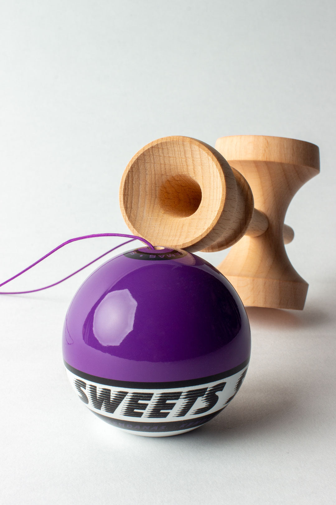 Kendama Starter Purple with a glossy purple tama and natural wood ken, perfect for beginners learning kendama.