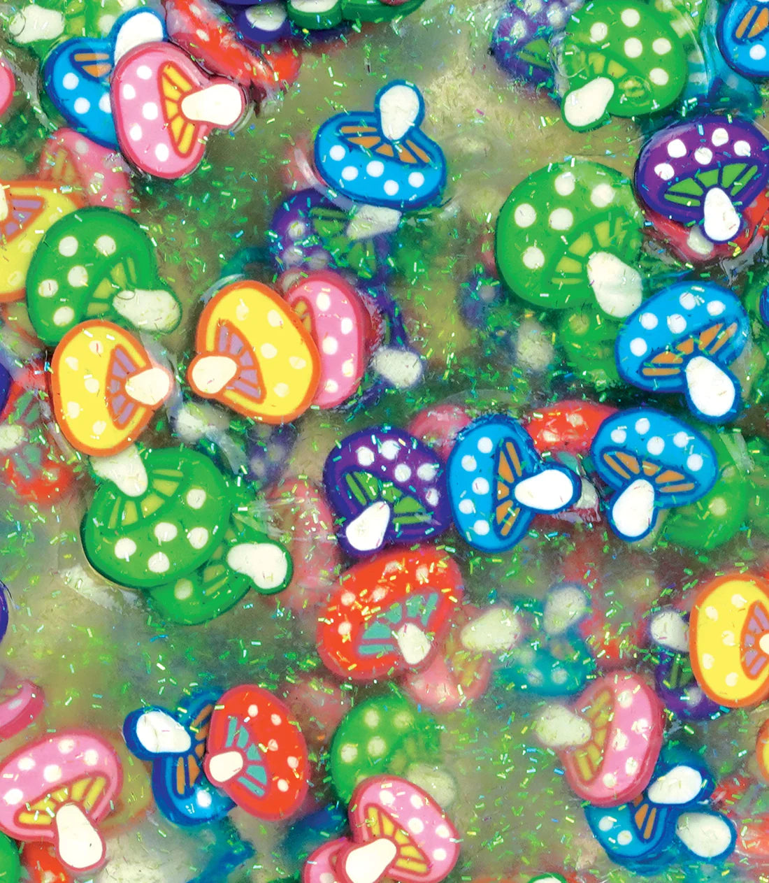 Close-up of colorful mushrooms hidden in clear putty in the Hide Inside! Gnome Home Thinking Putty product.