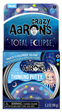 Cosmic Glows Total Eclipse Thinking Putty multi-colored glow putty in collectible space-themed packaging