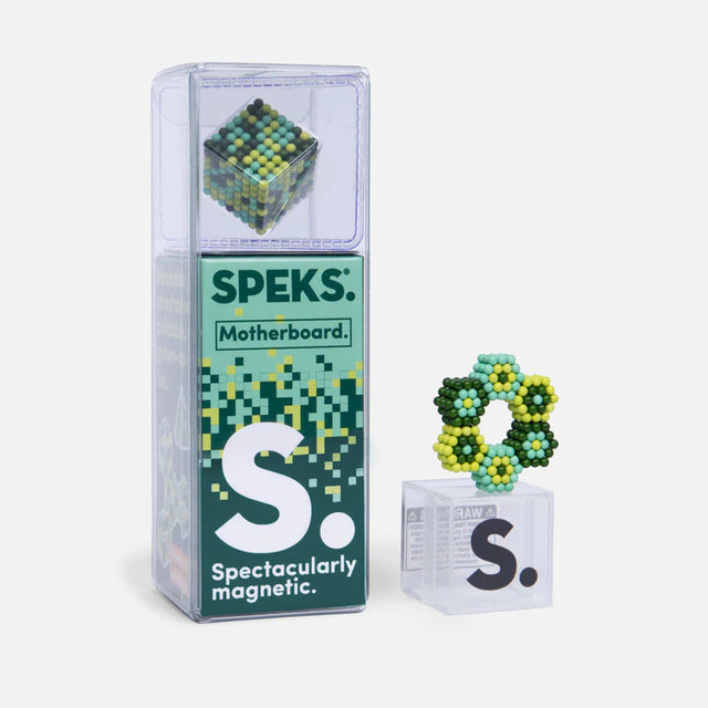Speks. Pixel. Motherboard. magnetic balls in green and yellow, shown in packaging and arranged in a hexagonal shape.
