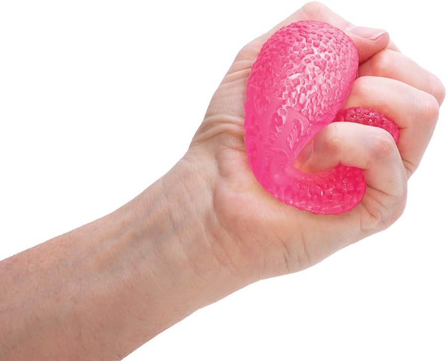 Hand squeezing bright pink textured NeeDoh Gumdrop toy with firm, squishy doh filling and neon color.