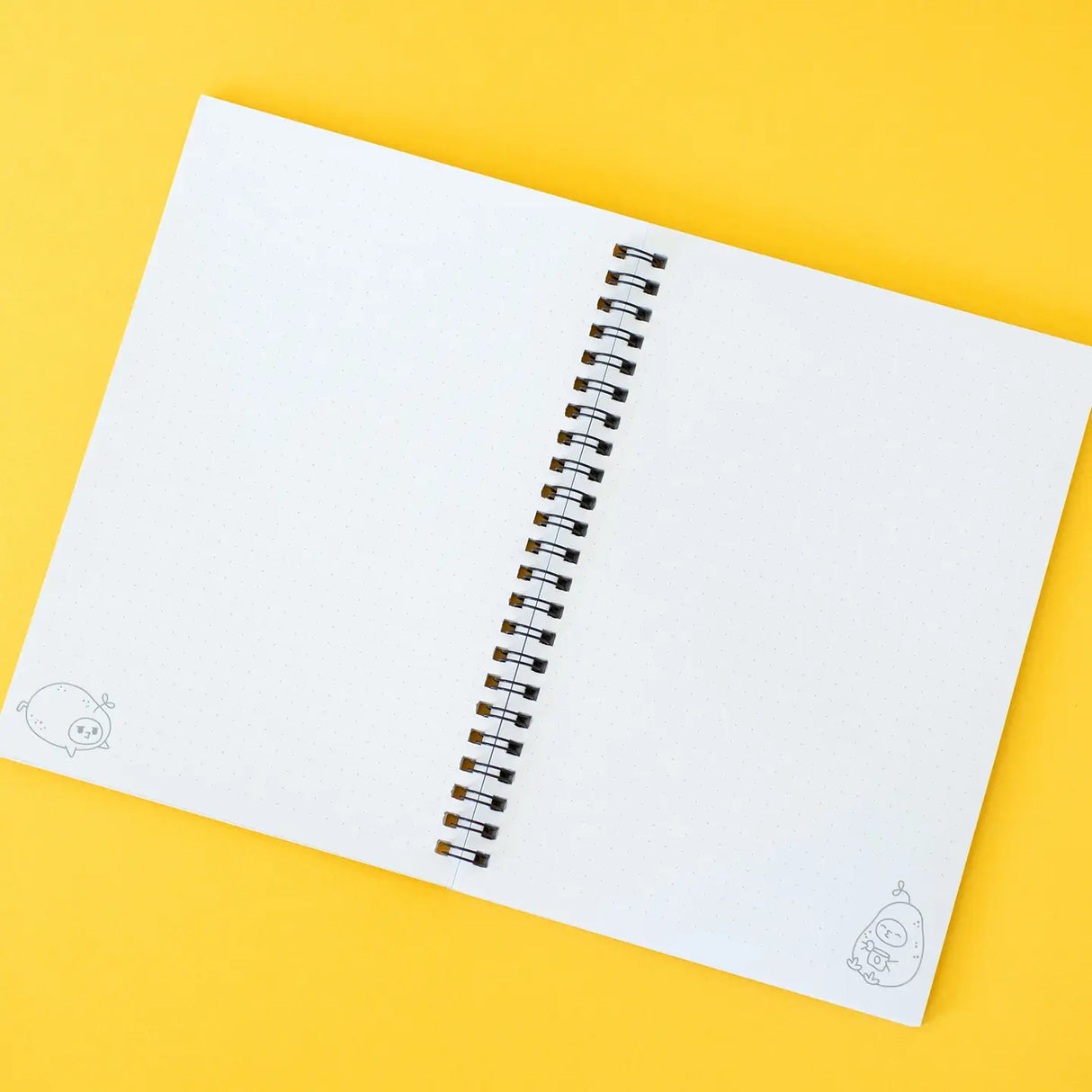 Open Grumpy Chicken Potato Mode Notebook showing dotted spiral-bound pages on yellow background.