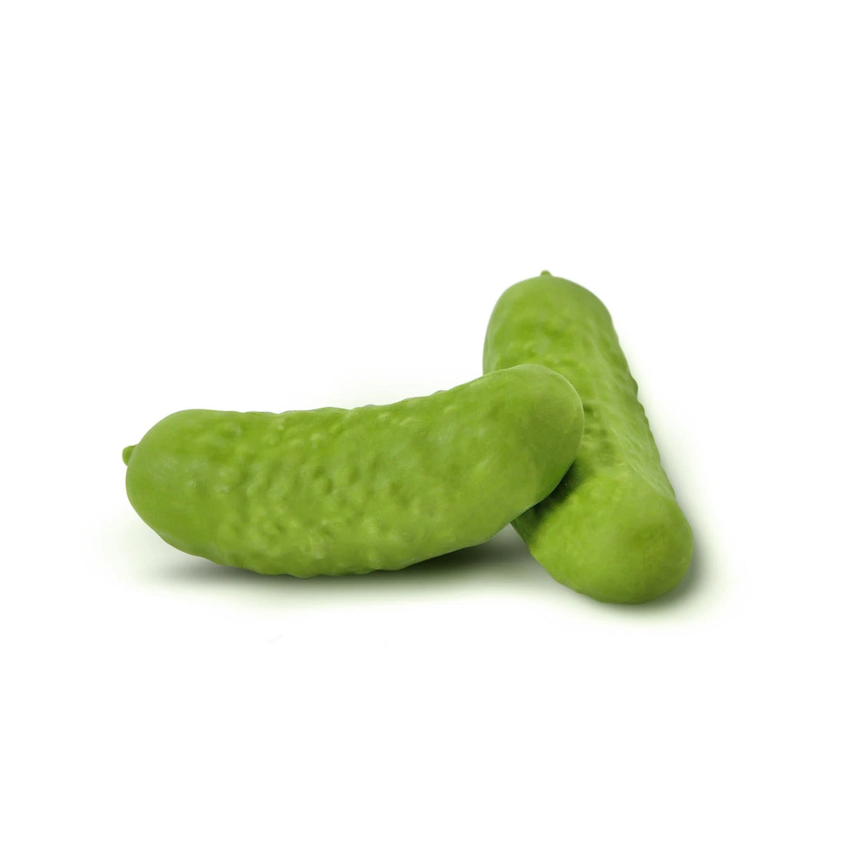 Two realistic green mini pickle erasers lying on a white surface, perfect for fun correction, product Pickle Erasers.