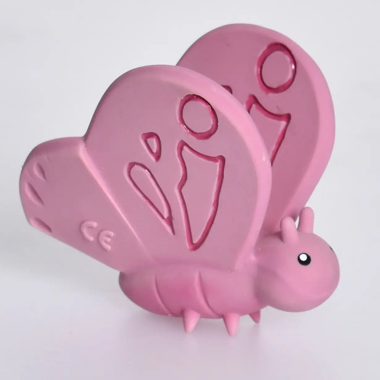 Organic Rubber Teether Rattle | Butterfly in soft pink, made from natural rubber with an enclosed rattle for babies.