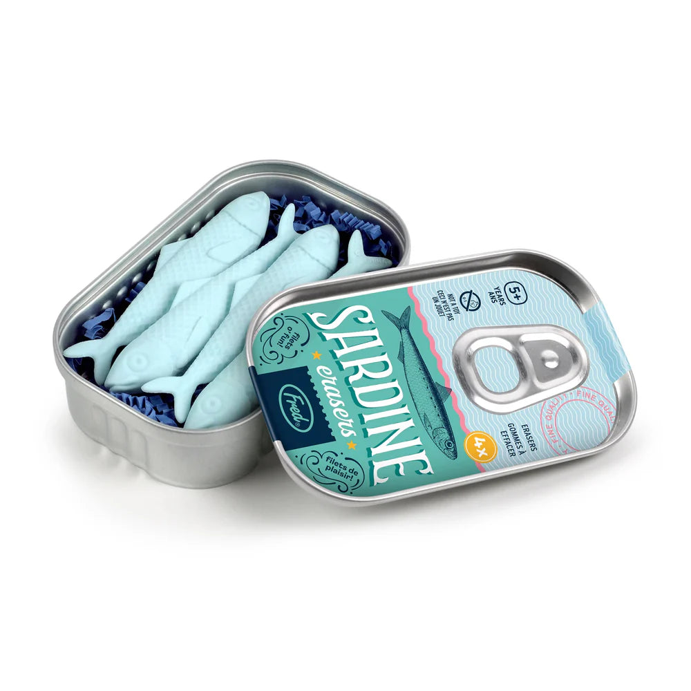 Open metal tin with four light blue sardine-shaped erasers inside on white background