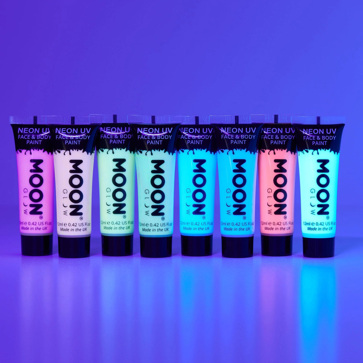 Face & Body Paints| Neon UV Glow tubes in vibrant colors glowing under UV light, showcasing neon face and body paint.