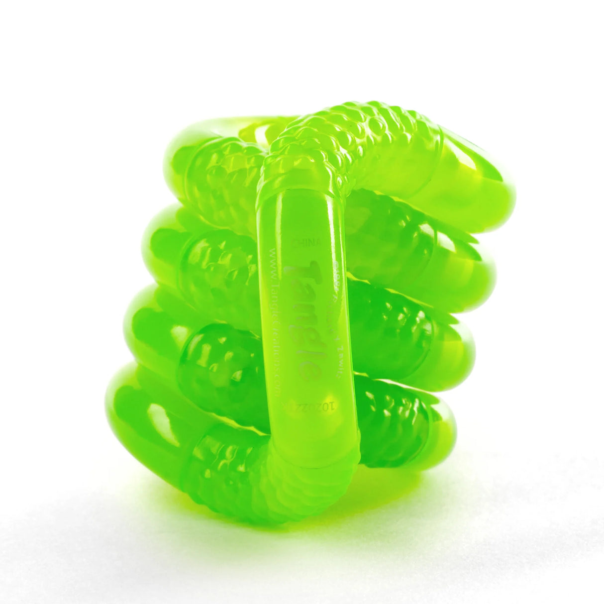 Tangle | Glow in the Dark bright green glowing fidget toy with textured curved segments for twisting and turning.