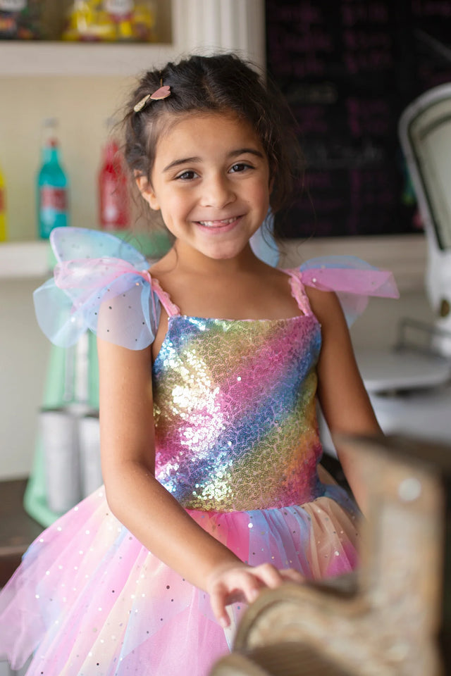 Rainbow Fairy Dress & Wings | Size 5-6 with sequinned rainbow top, layered skirt, and matching pastel wings worn by smiling girl.