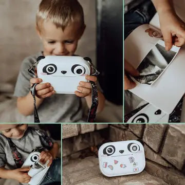 Print & Digital Camera Model P | Koko the Panda held by a child, showing instant black-and-white photo prints.